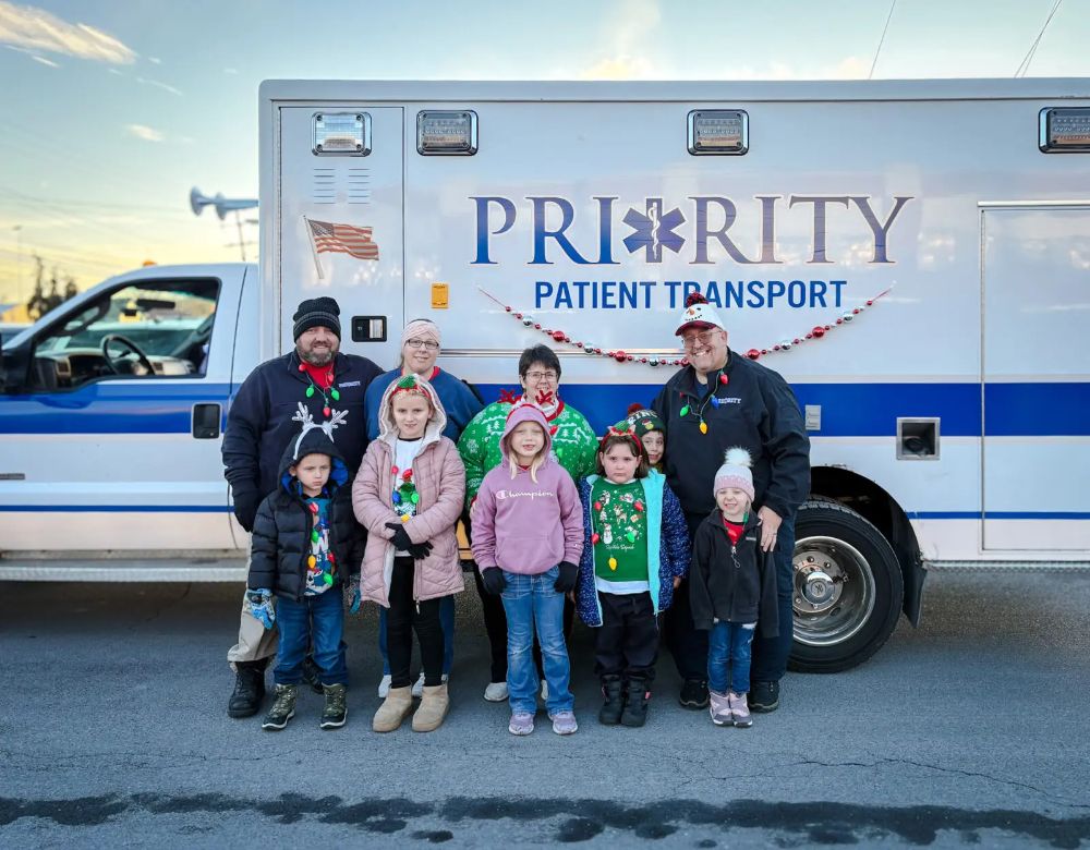 EMS crew with a family at a Christmas parade